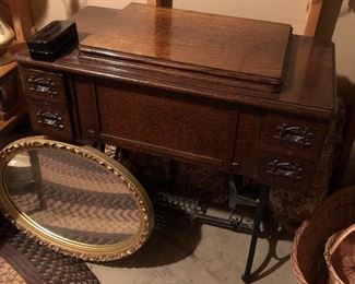 Antique White Rotary sewing machine with cabinet.