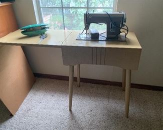 MCM sewing machine and cabinet $50