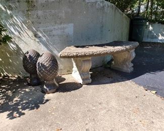 Metal garden accessories and concrete bench