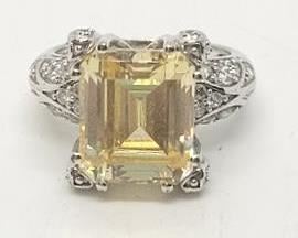 31 - Sterling size 6 ring, emerald cut yellow gemstone
