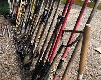Lots of long handle tools, shovels, rakes, post hole diggers, cutters, hay forks, hoes, etc....