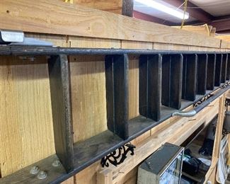 Approximately 12 foot antique ladder. Sometimes called a gliding rolling library ladder.  Has been renewed and looks really nice.  Makes for a great shop piece....