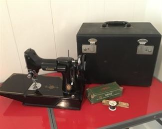 Singer featherweight sewing machine with Case, booklet, and attachments