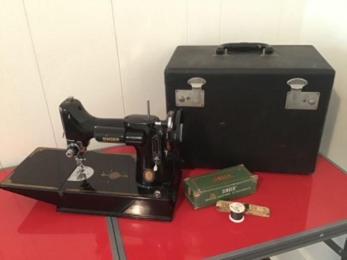 Singer featherweight sewing machine with Case, booklet, and attachments