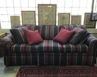 Sofa and pillows, Collection of needlework Samplers, some antique