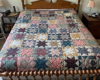 Another view of the bed and quilt