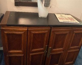 CABINET THAT HOLDS LEAVES TO DINING TABLE