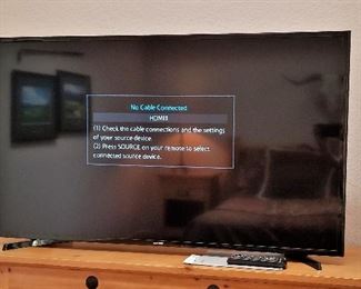 Large TV for sale.