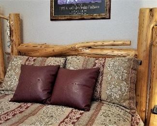 Queen handcrafted log bed with queen mattress. Leather pillows and bedding for sale.