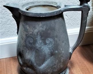 Antique pitcher with woman's head