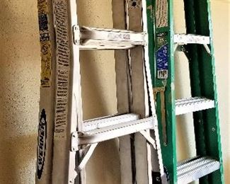 Extending ladder and green ladder for sale.