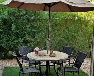 Round table and umbrella and 4 patio chairs