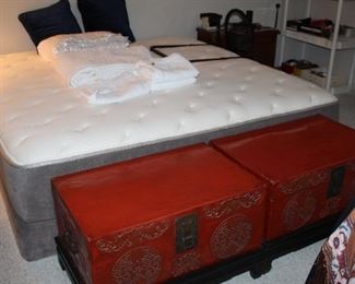 pair of red storage trunks