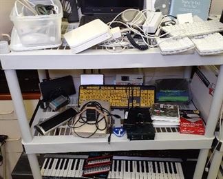 Apple, Mac PowerBook G3 laptop, Apple keyboards, mouse, Ipad docs, GEM DSK keybord with cartridges.