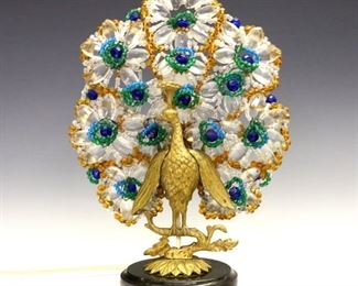 Lot 1:  An Art Deco era Czechoslovakian beaded glass Peacock lamp.  Gilded metal lamp in the form of a Peacock with multicolor glass beaded plume, on a round Marble base.  Minor wear overall, some small losses to the beadwork.  9" x 12 1/4" high.  ESTIMATE $600-800