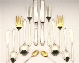 Lot 21: Seventy-six pieces of Gorham "Late Georgian" pattern Sterling Silver flatware.  Features 8 seven piece place settings plus additional spoons and serving pieces.  Includes 8 x 8 3/4" table knives, 8 x 5 3/4" butter knives, 8 x 7 1/4" dinner forks, 8 x 6 1/2" Gold washed salad forks, 16 x 6" teaspoons, 8 x 6 1/4" soup spoons, 3 x 8 1/2" serving spoons, 11 x 4 1/4" Gold washed sugar spoons, 3 x 6-8 1/4" Gold washed serving utensils, plus 3 additional hollow handled items.  68.77 total troy ozs plus 12 hollow handles, approximately 74.77 troy ozs total Sterling weight.  Minor wear overall.  ESTIMATE $2,000-3,000