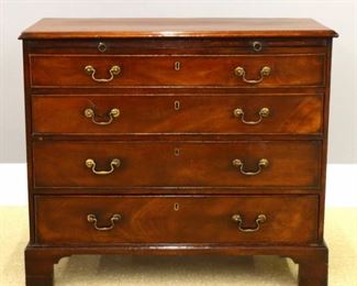 Lot 23: A late 18th century British George III Period gentleman's chest.  Mahogany construction with molded top, over a dressing slide and four long dovetailed drawers, on a molded base with bold bracket feet.  Repolished with minor wear.  37 x 17 1/2 x 32" high overall.  ESTIMATE $400-600