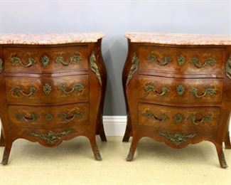 Lot 38: A pair of mid 20th century French Louis XV style Bombe commodes.  Rosewood construction with inlaid foliate detail on the drawers and sides cast Bronze handles and mounts.  Each with three dovetailed drawers and molded Rouge marble tops, shaped skirts and flared feet.  Original finishes with minor damage, one repaired marble, lacks one drawer lock.  Each 34 x 16 1/2 x 35" high overall.  ESTIMATE $2,000-3,000