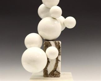 Lot 56: Hugh Acton, American, 1925-2018.  A mid 20th century Marble abstract sculpture.  Nine globes of varying size on a plinth and base in shades of White and Taupe.  Incised "Acton" signature at center globe.  Some surface wear and minor flakes to globes, two 1/2" areas of repair to plinth edge, and small chip to base.  16 1/2" high.  ESTIMATE $1,000-2,000