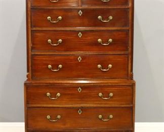 Lot 73: A late 18th century British George III Period chest on chest.  Mahogany construction with a molded cornice over two short and three long dovetailed drawers with upper section and fluted corner columns, lower with three long drawers and lower section on a molded base with ogee bracket feet.  Older finish with nice color, some older repairs, minor surface wear.  40 1/2 x 21 x 69" high overall.  ESTIMATE $1,000-1,500