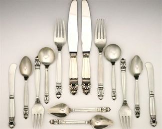 Lot 83: Sixty-eight pieces of Georg Jenson "Acorn" pattern Sterling Silver flatware.  Features 8 seven piece place settings plus additional spoons and serving pieces.  Includes 8 x 9" table knives, 8 x 6" butter knives, 8 x 7 1/2" dinner forks, 8 x 6 1/2" salad forks, 12 x 5 1/2" citrus spoons, 12 x 5 1/2"  teaspoons, 7 x 5 1/8 soup spoons, 2 x 8" serving spoons, plus 3 additional hollow handled items.  61.14 total troy ozs plus 19 hollow handles, approximately 70.64 troy ozs total Sterling weight.  Minor wear, missing one soup spoon.  ESTIMATE $2,000-3,000
