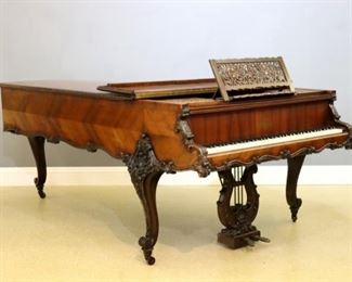 Lot 90: A 19th century French Grand piano by Erard, Paris.  Book-matched Rosewood case in the Louis XV style with hinged cover and gadrooned edge, pierced carved music rack, tall cabriole legs with elaborate shell carved knees in foliate wreaths, scrolled apron and conforming foliate carving.  Serial #71717 indicates a production date of 1841-1850.  Older refinishing with some wear, some loose and minor veneer losses.  55 x 98 x 41" high overall.  ESTIMATE $6,000-8,000
