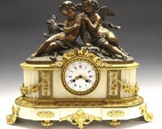 Lot 93: A 19th century Louis XVI style French mantel clock.  Bronze and Marble case featuring Cupid and Eros above a White Marble base with fine Gilded Brass mounts and swags.  8-day time and strike movement with a porcelain dial, Blue Roman hour numerals and outer ring with Arabic minute indicators.  Case with some wear, lacks glass in front and rear doors, lacks bell, not running when cataloged.  21 x 7 1/2 x 17 1/2" high overall.  ESTIMATE $1,000-2,000