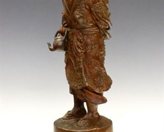 Lot 99:  turn of the century Japanese Bronze figure.  Depicted standing in a floral Kimono with a teapot in hand and a child on her back, on a turned wooden plinth.  Minor surface wear.  13 1/2" high overall.  ESTIMATE $400-600