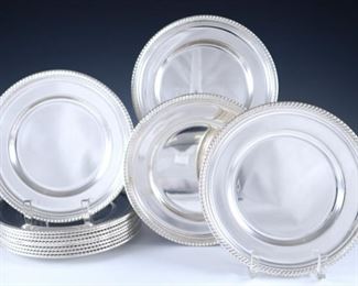 Lot 18: A set of twelve Gorham "English Gadroon" pattern Sterling Silver bread and butter plates.  Marked "Gorham, Sterling" with hallmarks and model numbers.  36.02 troy ozs total weight.  Minor surface wear.  ESTIMATE $1,200-1,500