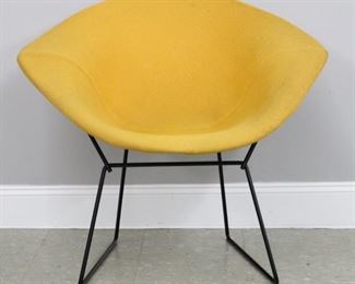 Lot 117: A mid 20th century Harry Bertoia for Knoll "Diamond" chair.  Upholstered seat in Yellow/Orange on a Black vinyl coated Steel frame with mesh back.  "Knoll" label beneath seat.  Minor wear, some discoloration to upholstery.  Approximately 34 x 28 x 30 1/4" high overall.  ESTIMATE $200-400