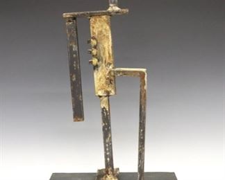 Lot 120: Mary Lee Adler, American, 20th century.  A 21st century Steel Brutalist style sculpture.  Unsigned, intentional gradation to patina, some surface scratches, small chip to corner of base.  14 1/4" high overall.  ESTIMATE $200-400