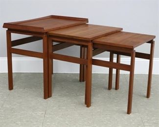 Lot 127: A set of mid 20th century Moreddi nesting tables.  Teak construction with box joinery, largest table with stepped beveled edge.  "Moreddi" crown stamp at underside of smallest table.  Minor wear, faint staining to top of largest table, light scratches to top of nesting tables.  Up to 23 x 15 x 20 1/2" high overall.  ESTIMATE $100-200