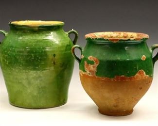 Lot 131: Two late 19th century French Terra Cotta confit pots.  Two handle confit pots with Green glaze.  Surface crazing and some edge flakes.  9 1/4 and 10 1/4" high.  ESTIMATE $300-400