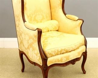 Lot 132: A 19th century French Bergere.  Walnut frame with carved floral crest, molded arms, shaped skirt and cabriole legs.  Recently re-upholstered in Yellow Damask, frame refinished with minor wear, restoration to rear legs.  42" high.  ESTIMATE $800-1,200