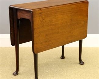 Lot 134: An 18th century British George II Period drop leaf side table.  Mahogany construction with a rounded edge top, gate-leg base with shaped ends, on tall cabriole legs with pad feet.  Older finish with some wear, minor surface damage, old repairs at hinges and leg joints.  30 x 14 (46" open) x 28 1/2" high overall.  ESTIMATE $400-600