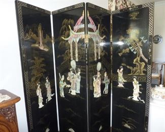 Asian screen with carved characters