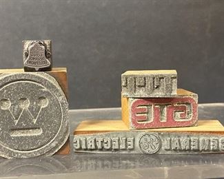 Printing press stamp blocks of company logos