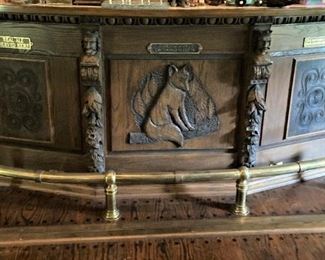 Detailed carved bar (a fox, no less) in the pub . . . brass foot rail (The pub stays as is . . . with the house.)