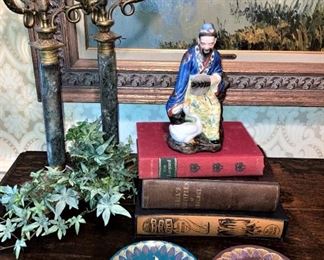 Antique candle holders, old books, and décor 