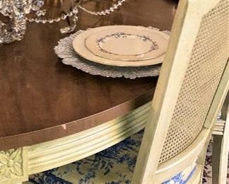 The other chairs are custom upholstered with yellow and blue toile.