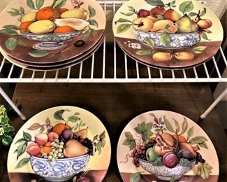 Two sets of four Limoges plates