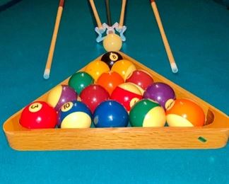 Lot 9002-A $1595.00. AMF 8' Pool Table, Stately table crafted in cherry, with green felt table  and sides, leather pockets, claw and ball feet, includes balls, triangle, all accessories, 4 pool cues and a bridge. If you've been looking for a pool table that looks as great as it plays, this is your table!