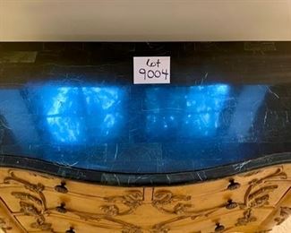 Lot 9004. $225.00. Four-Drawer chest with Dark Stone Top, Carved Drawers, Legs and Trim.  Unbranded, Bombé Style 42"w, 18.5"d, 31.5 " High.  Very functional and good looking table!  Middle drawer needs glider reattached.