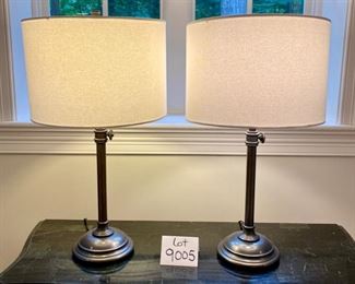 Lot 9005. $90.00  Pair of Heavy-Duty Attractive Table Lamps, Cream round shades, one has stain, Bronze Colored Bases with weight,  26.5" tall.  Shade that's soiled can either be displayed with the soiled spot in the back or cleaned or replaced.  Nice looking lamps!