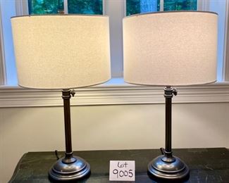 Lot 9005. $90.00 Pair of Heavy Duty Attractive Table Lamps, Cream round shades, one has stain, Bronze Colored Bases with weight,  26.5" tall.  Shade that's soiled can either be displayed with the soiled spot in the back or cleaned or replaced.  Nice looking lamps!