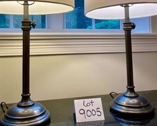 Lot 9005. $90.00 Pair of Heavy Duty Attractive Table Lamps, Cream round shades, one has stain, Bronze Colored Bases with weight,  26.5" tall.  Shade that's soiled can either be displayed with the soiled spot in the back or cleaned or replaced.  Nice looking lamps!