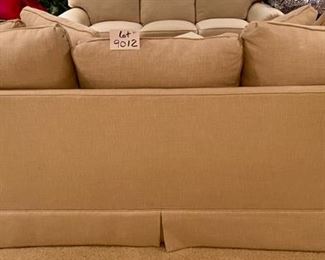 Lot 9012. $1,395.00 Vanguard American Bungalow Main Street Sofa in  cream Color, This is not the true color, more of lighting thing.  Purchased at Toms-Price.  Includes:  4 pillows, rolled arms, high-end fabric.  86" W  x 35" Deep,  We think it is down and very comfy. 