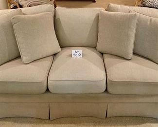 Lot 9012. $1,395.00 Vanguard American Bungalow Main Street Sofa in  cream color, Purchased at Toms-Price.  Includes:  4 pillows, rolled arms, high-end fabric.  86" W  x 35" Deep,  We think it is down and very comfy. 