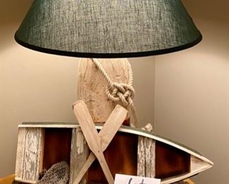 Lot 9016. $48.00  Interesting Rowboat and Oars Lamp, Green Shade, 17" Diameter, 25" Tall, 21" Wide, Nautical Theme lamp with Buoy for the Frame.  Yellow streaking inside shade, not problematic.  