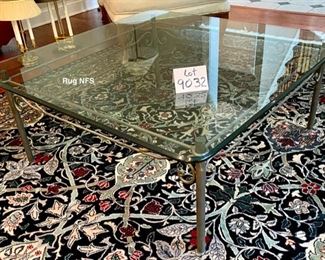 Lot 9032. $550.00. Glass & Iron Coffee Table with a very clean line - will fit any decor.  Measures 42" square, x 17" tall.  We like the fact that a glass coffee table opens up the room, where a wooden solid one might chop it up.  